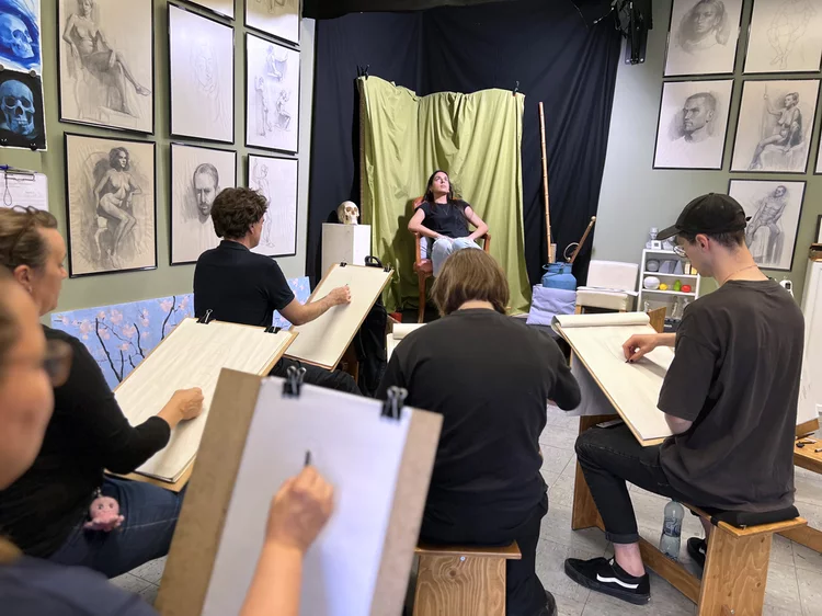 students at a portrait drawing session